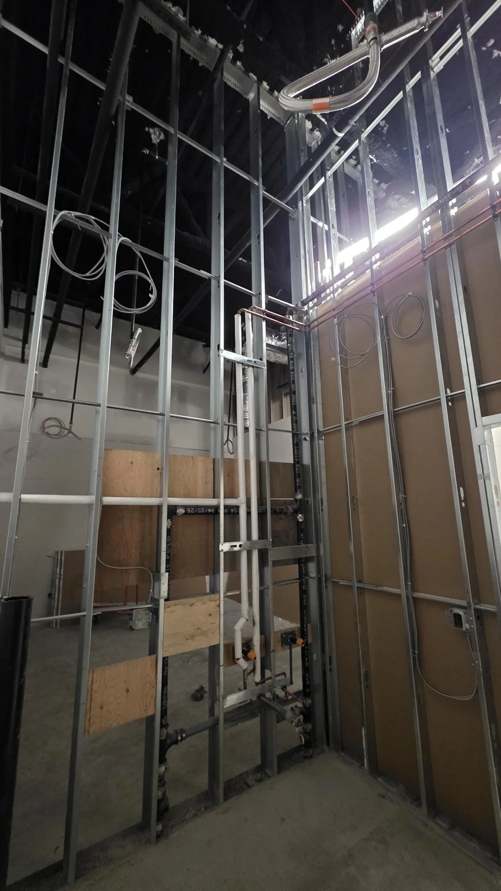 Full-height steel stud framing and backing before drywall at Club Champion in Surrey. Full-height steel stud framing and backing before drywall at Club Champion in Surrey.