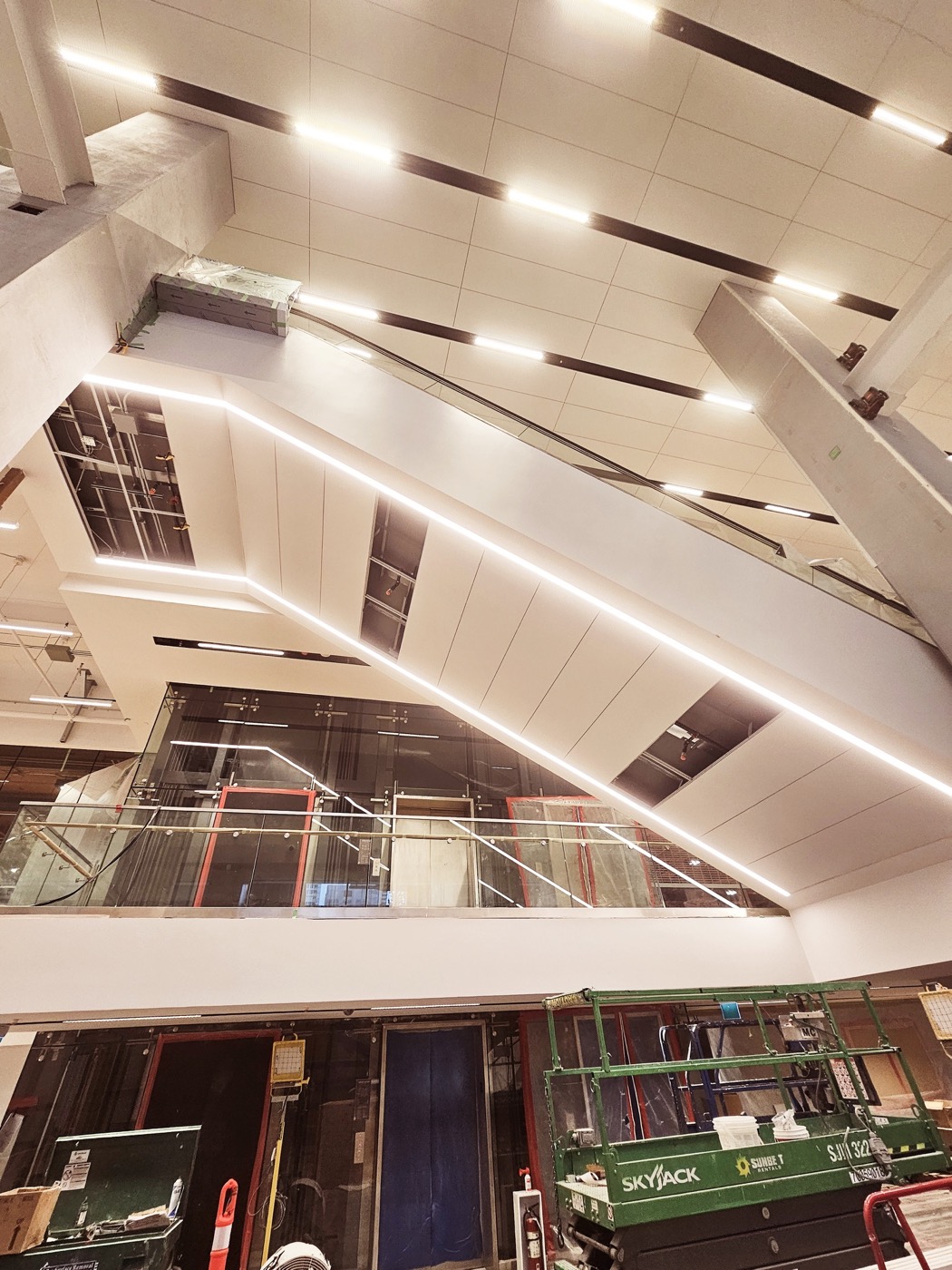 Curved linear specialty ceiling with integrated lighting completed by Rambo Walls and Ceilings. Curved linear specialty ceiling with integrated lighting completed by Rambo Walls and Ceilings.