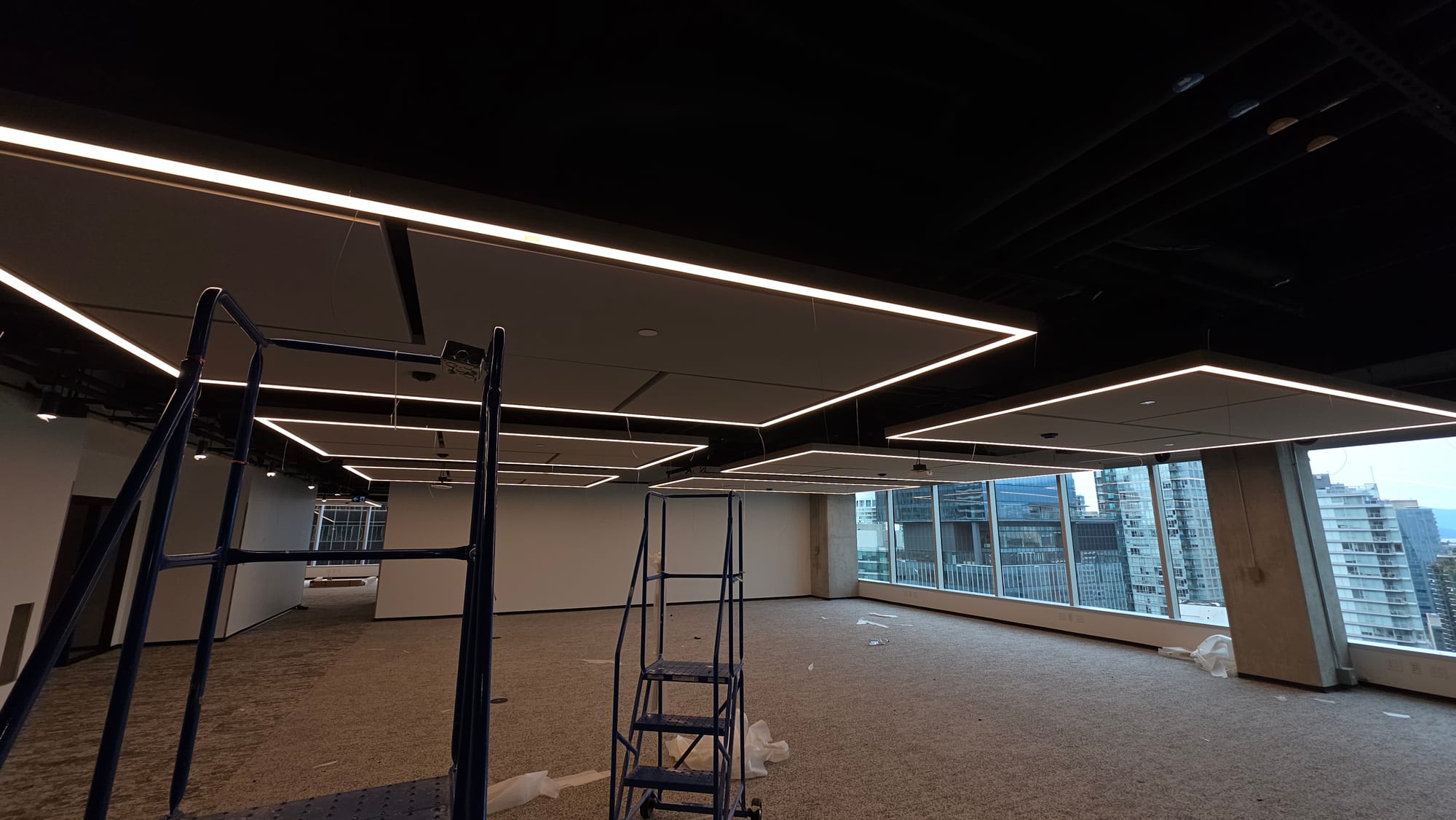 Wide view of suspended acoustic ceiling clouds installed for a Microsoft commercial interior. Wide view of suspended acoustic ceiling clouds installed for a Microsoft commercial interior.