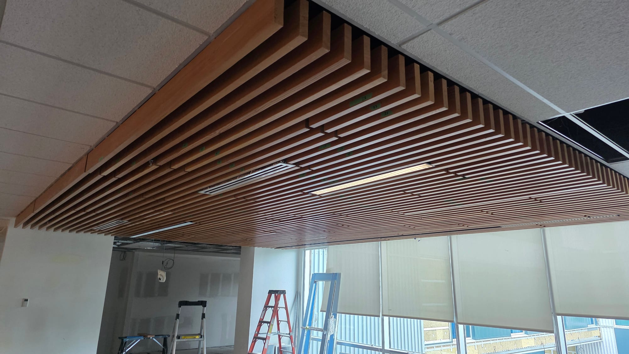 Wood-slat acoustic ceiling installed at Southpointe Academy. Wood-slat acoustic ceiling installed at Southpointe Academy.